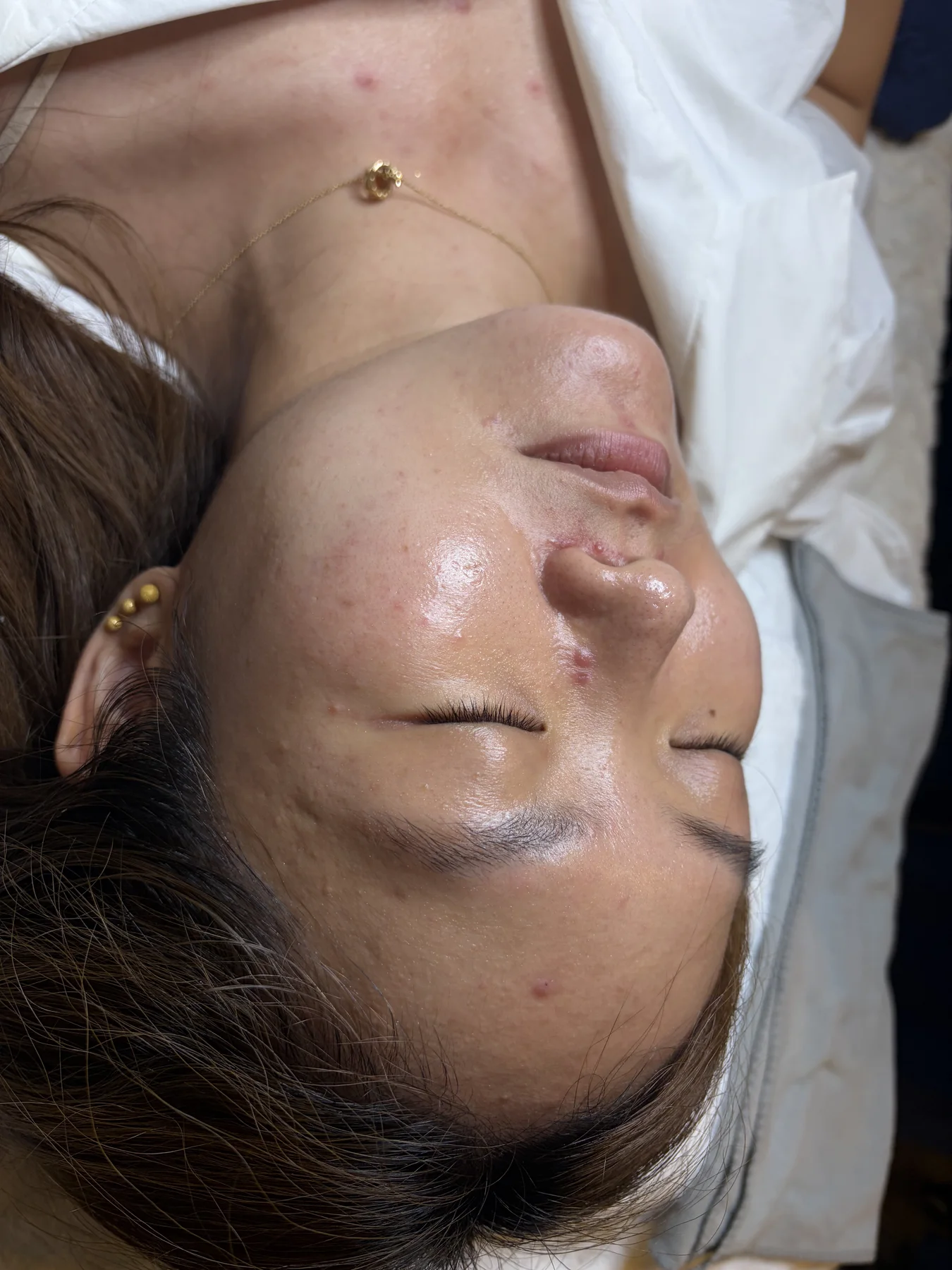 A client resting after a facial treatment