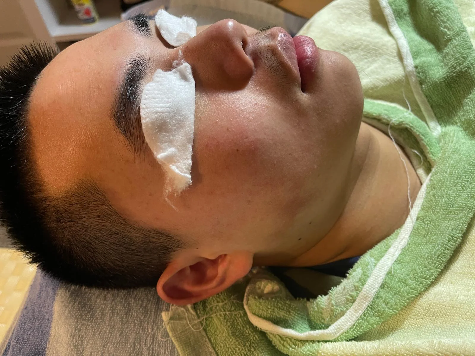 A client resting during a careful facial treatment