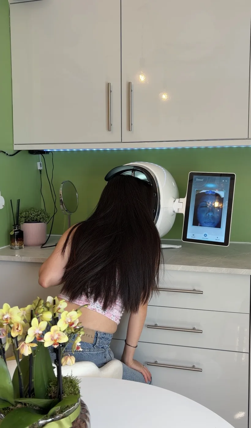A client receiving a digital skin analysis at Hailey Beauty