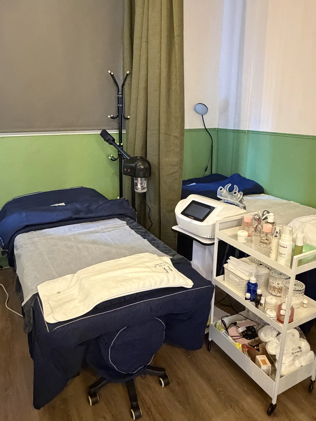 A prepared treatment bed and facial equipment at Hailey Beauty